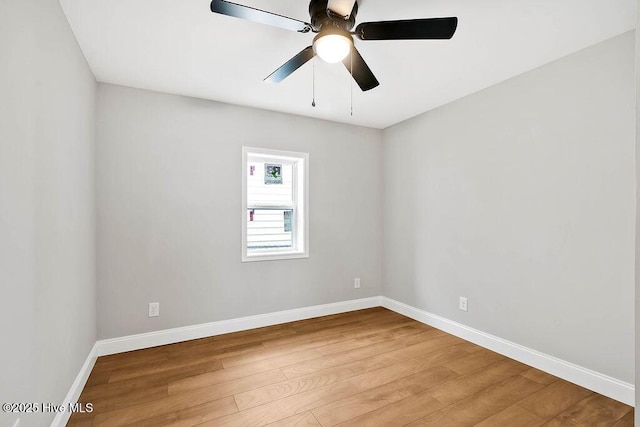 empty room with light wood-type flooring, baseboards, and ceiling fan