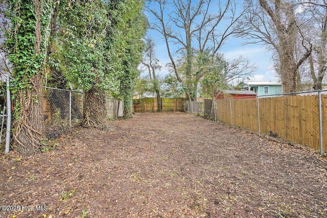 view of yard with a fenced backyard