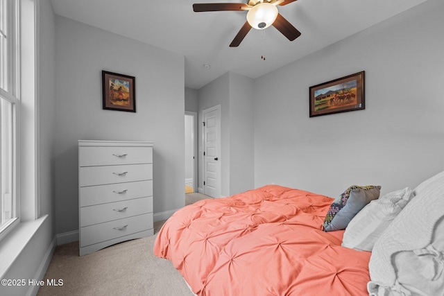 bedroom with baseboards, carpet floors, and ceiling fan