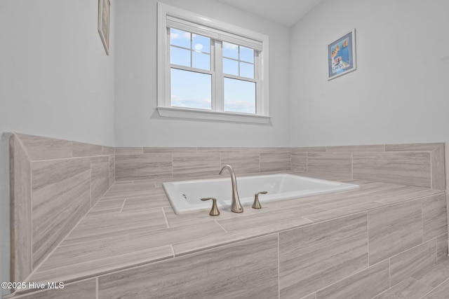 bathroom featuring a garden tub