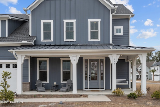 view of front of house featuring a porch, board and batten siding, and a standing seam roof