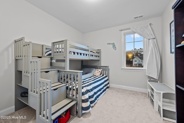 bedroom with visible vents, baseboards, and carpet floors