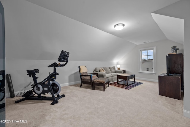 workout room with vaulted ceiling, baseboards, and carpet floors