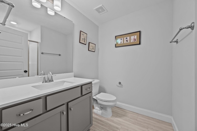 full bath featuring visible vents, baseboards, toilet, and vanity