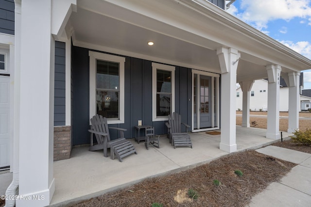 view of patio / terrace with french doors and a porch