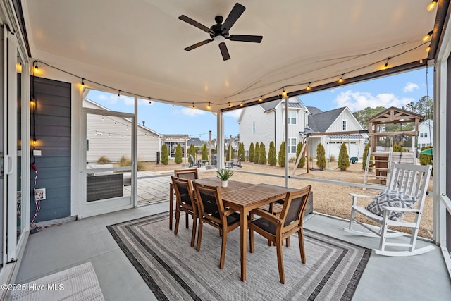 view of patio with outdoor dining area and ceiling fan