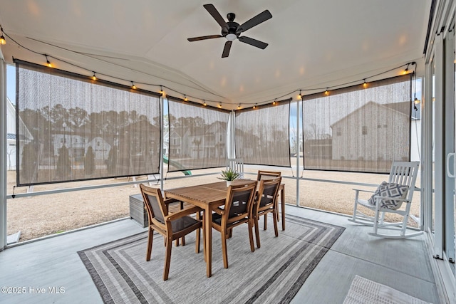 sunroom / solarium featuring lofted ceiling and a ceiling fan