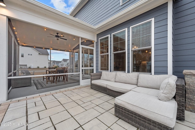 view of patio featuring an outdoor living space, outdoor dining area, and ceiling fan