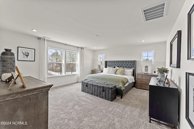 bedroom with visible vents, recessed lighting, baseboards, and carpet