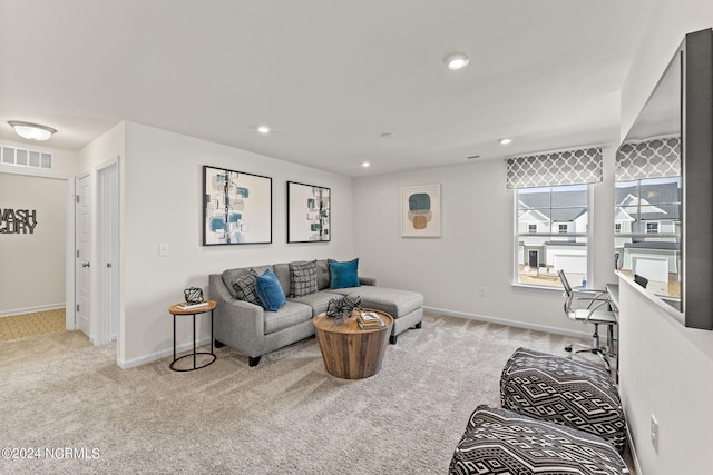 carpeted living room with recessed lighting, baseboards, and visible vents