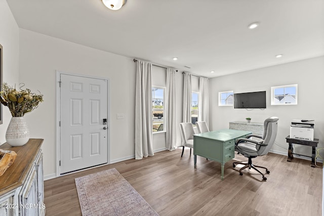 home office featuring recessed lighting, baseboards, and light wood-style flooring