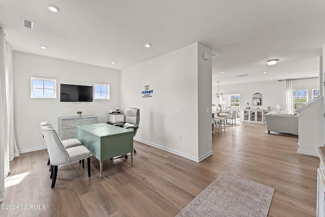 dining area featuring light wood-style flooring, recessed lighting, visible vents, and baseboards