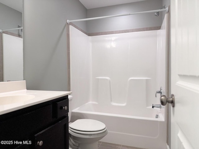 bathroom with toilet, vanity, and shower / bath combination