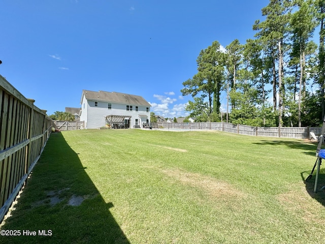 view of yard with a fenced backyard