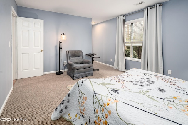 carpeted bedroom featuring visible vents and baseboards