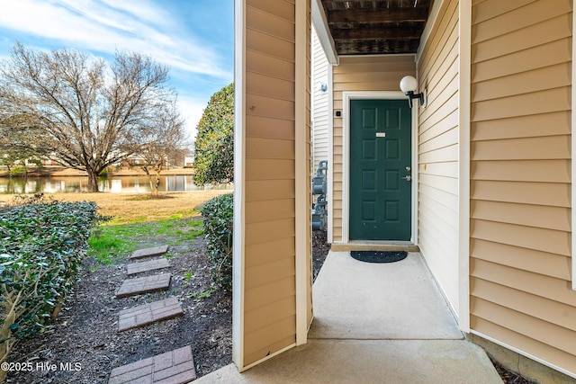 doorway to property featuring a water view