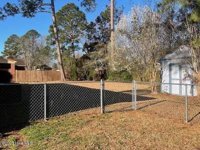 view of yard featuring a gate and fence