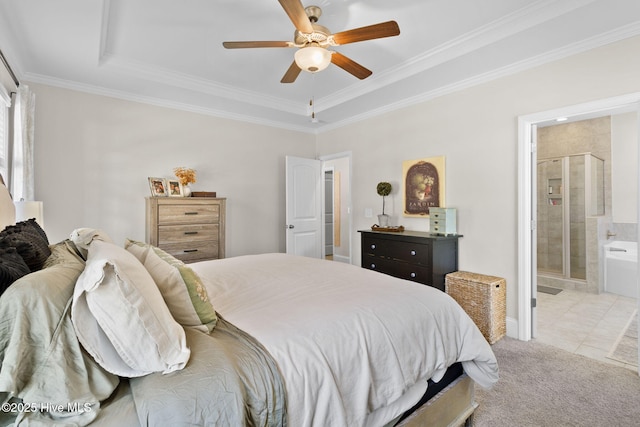 carpeted bedroom featuring ceiling fan, ensuite bath, and ornamental molding