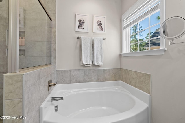 bathroom with a garden tub