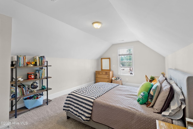 bedroom featuring carpet flooring, baseboards, and lofted ceiling