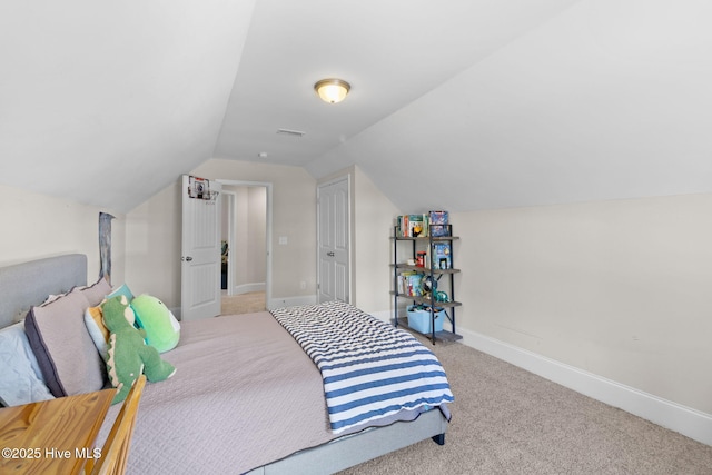 bedroom with visible vents, baseboards, lofted ceiling, and carpet