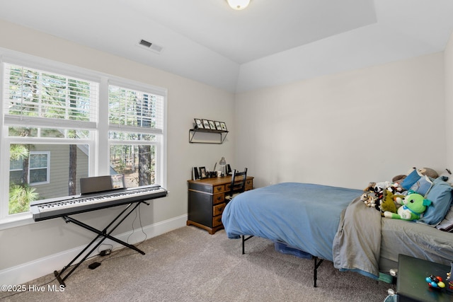 bedroom with vaulted ceiling, visible vents, baseboards, and carpet floors