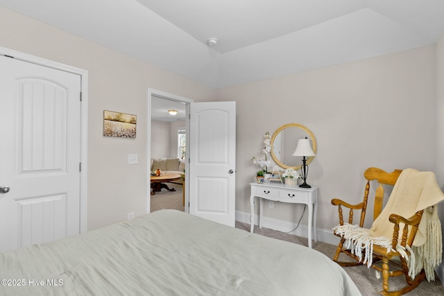 bedroom with carpet and baseboards