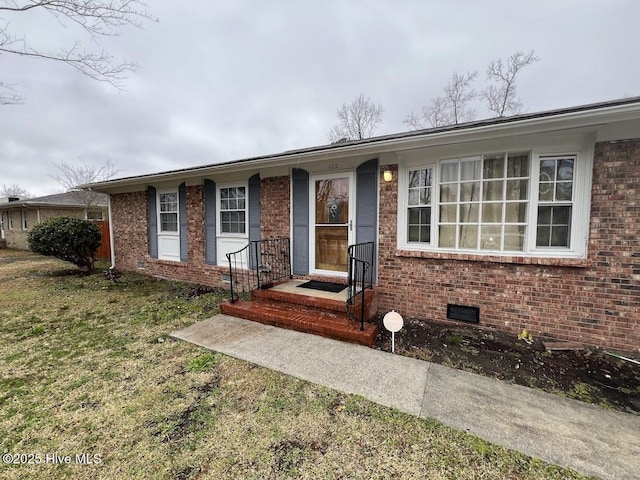 single story home with a front lawn, brick siding, and crawl space