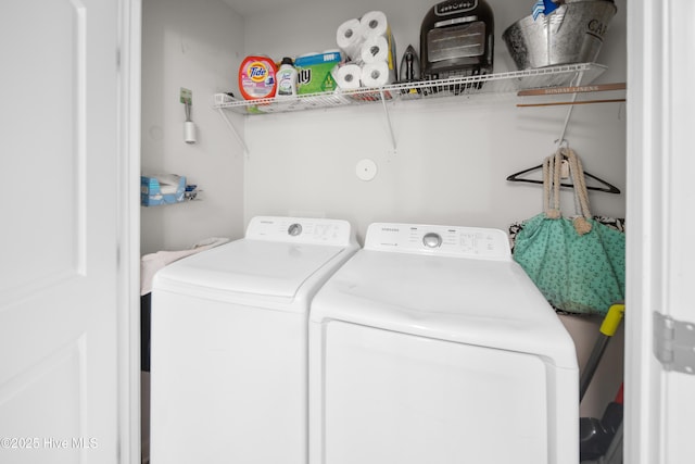 laundry room with independent washer and dryer and laundry area