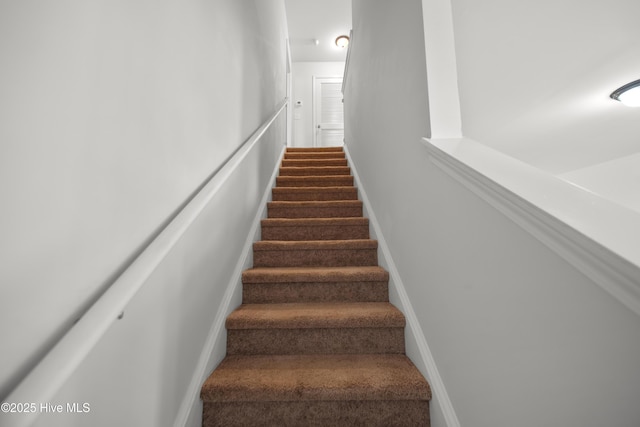 stairway with baseboards