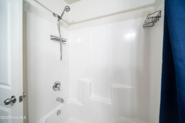 interior details with shower / bath combination with curtain