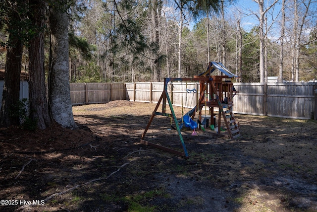 view of playground featuring a fenced backyard