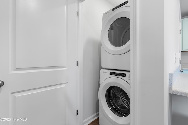 laundry area with laundry area and stacked washing maching and dryer