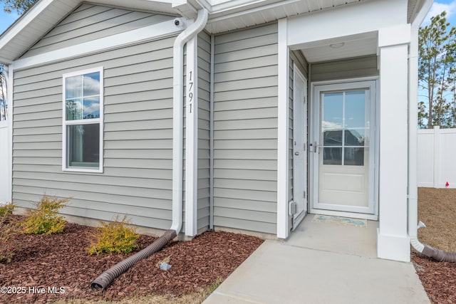 property entrance with fence