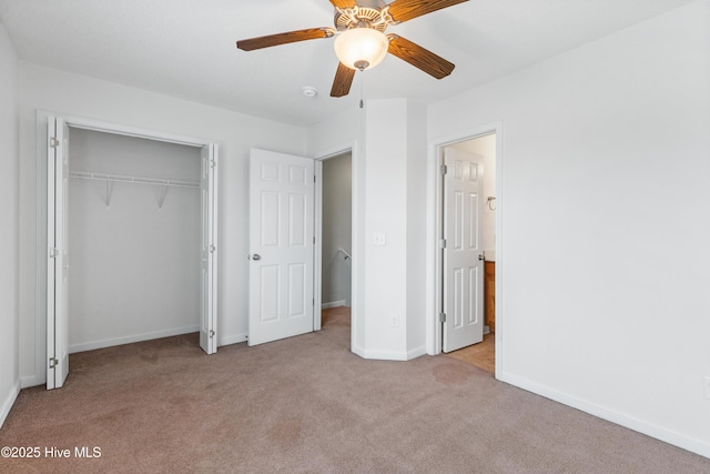 unfurnished bedroom featuring a closet, baseboards, a ceiling fan, and carpet flooring