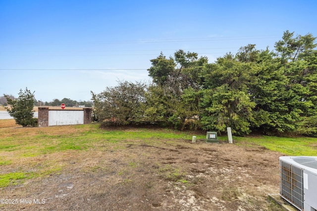 view of yard featuring central AC