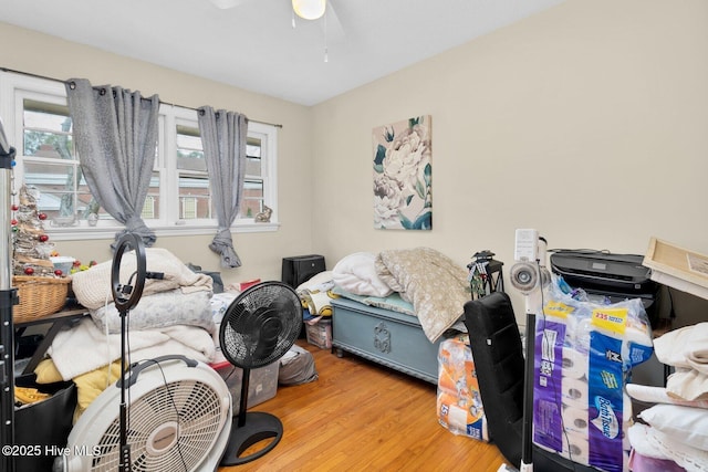 interior space with wood finished floors and ceiling fan