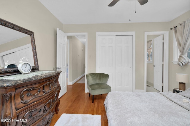 bedroom featuring a closet, ceiling fan, baseboards, and light wood-style floors