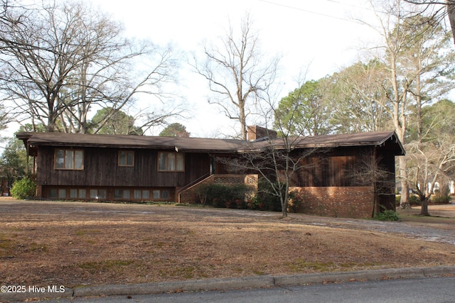 view of front of property featuring a chimney