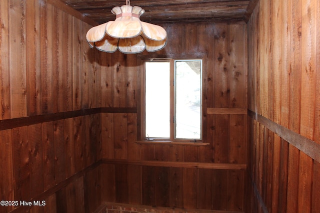 interior space featuring wooden walls