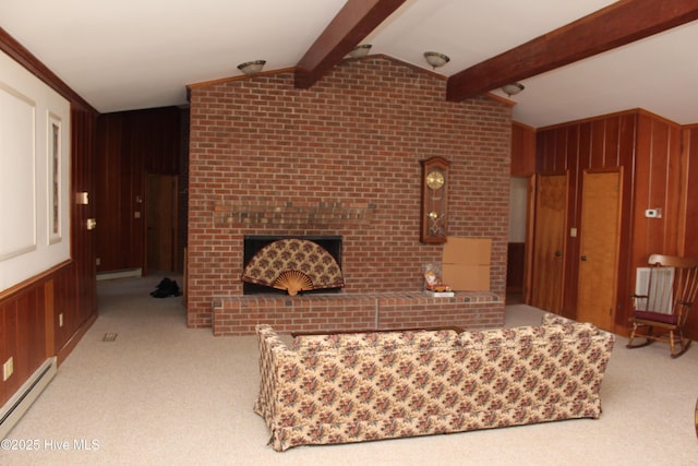 living area with carpet, vaulted ceiling with beams, wood walls, a baseboard heating unit, and baseboard heating