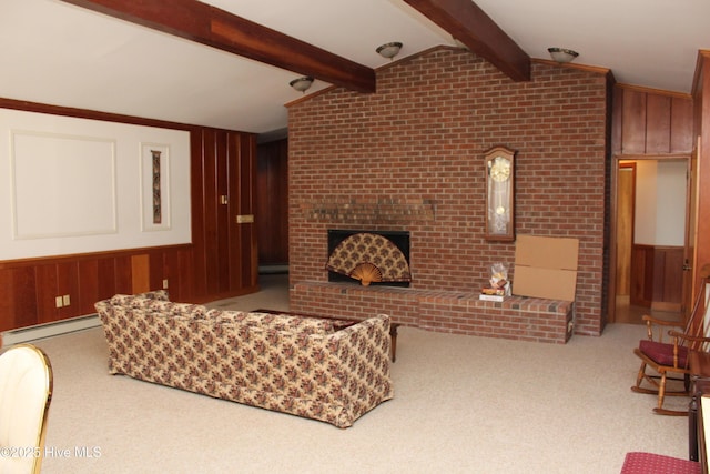 living area featuring wooden walls, carpet, vaulted ceiling with beams, a baseboard heating unit, and a brick fireplace