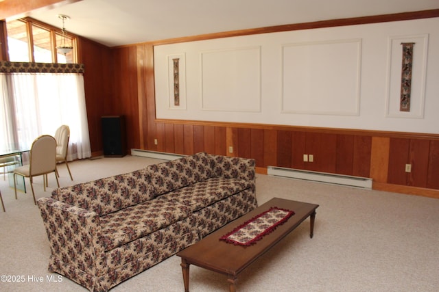 carpeted living room featuring a baseboard radiator, lofted ceiling, and wood walls