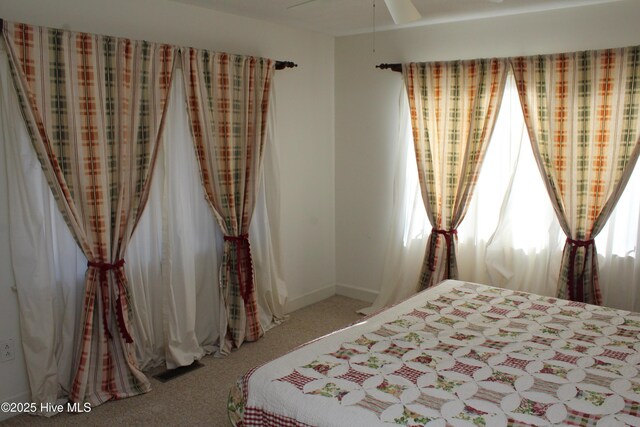 bedroom featuring carpet flooring and baseboards