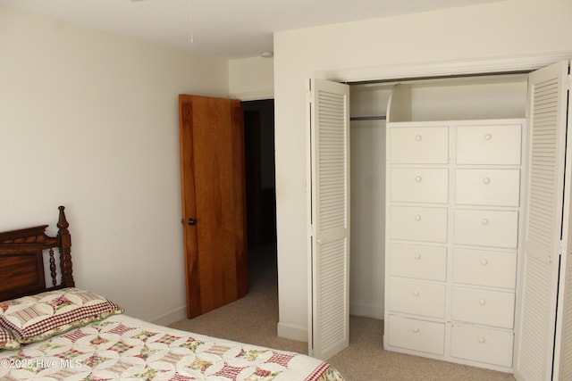 bedroom with a closet and carpet floors