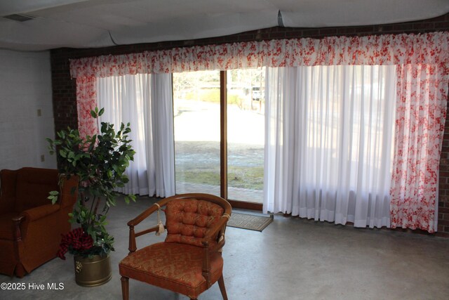 living area featuring finished concrete floors