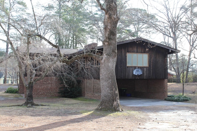 exterior space featuring brick siding