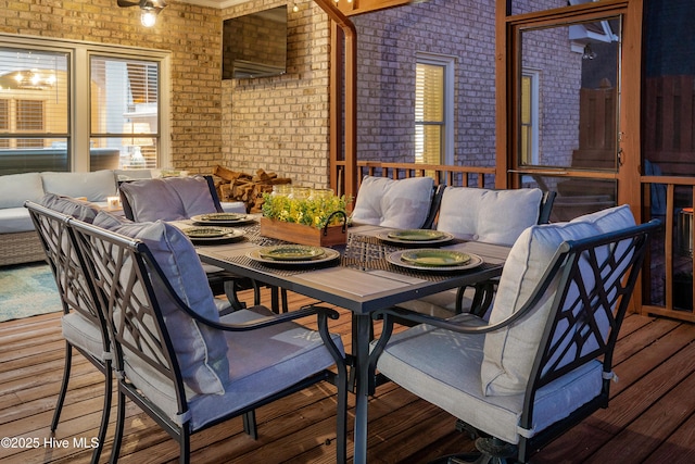 deck with outdoor dining space and an outdoor living space