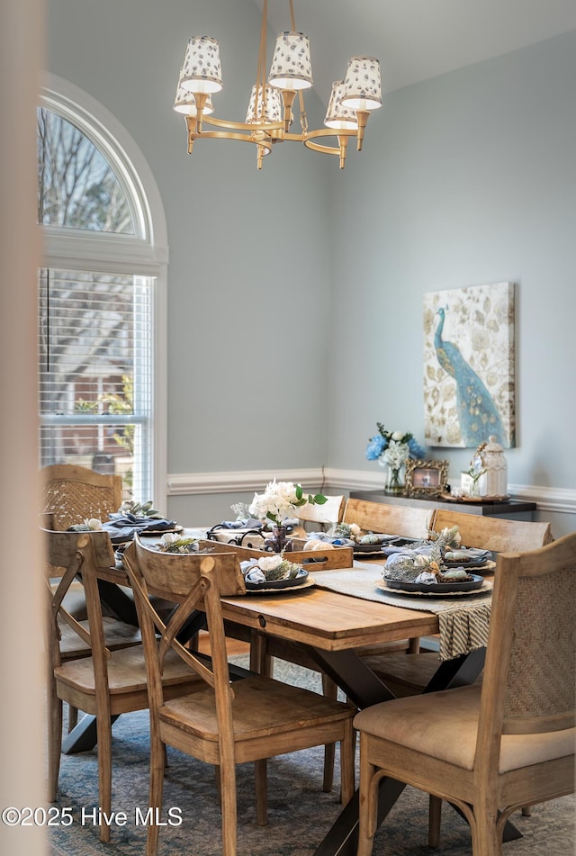 dining area with an inviting chandelier