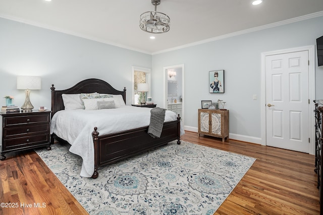 bedroom featuring recessed lighting, baseboards, wood finished floors, and ornamental molding